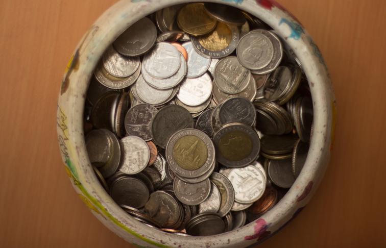 Money jar full of coins