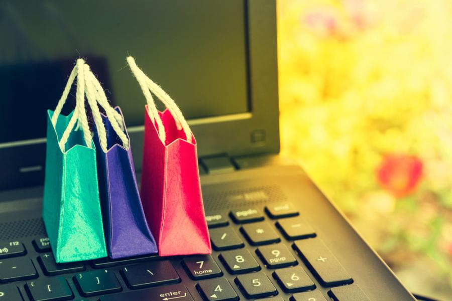 Shopping bags with computer keyboard, symbolising online shopping