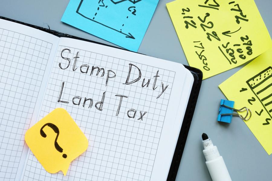Notebook with 'stamp duty land tax' written in it