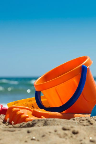 Children's bucket and spade on beach