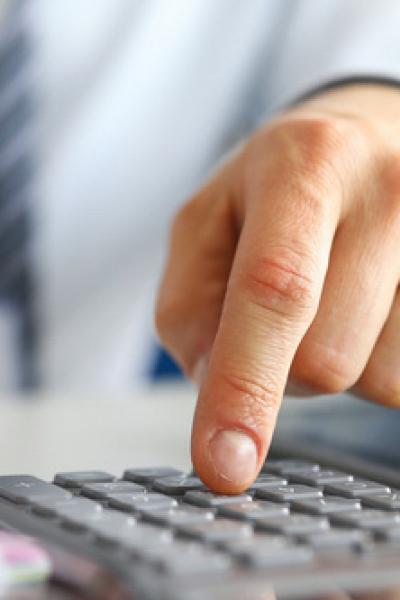 Man with calculator and pen